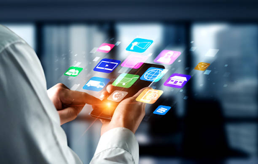 A person interacts with a smartphone displaying various app icons, highlighting the ease of native app development.